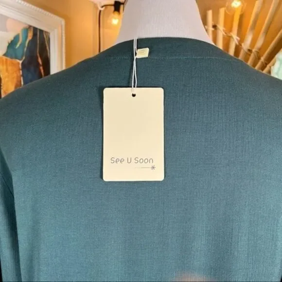 SEE U SOON | Puff Sleeve Emerald Smocked Oversized Wrap Dress - Picture 3 of 14